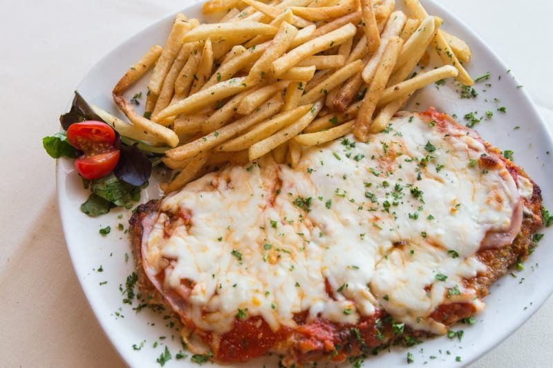 Milanesa Napolitana with melted mozzarella and French fries